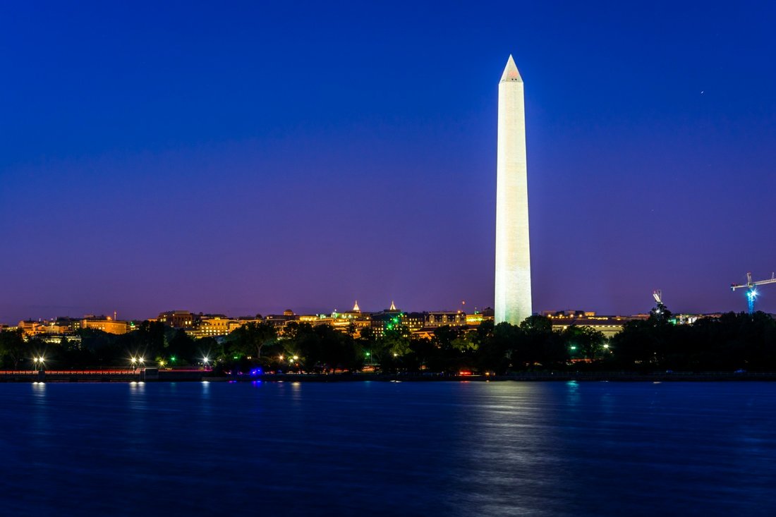 The Washington Monument reflected over the Tidal Basin at night